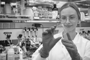 Scientist with microfluidic device
