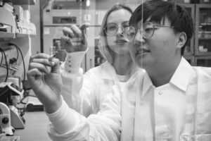 Scientists writing on board